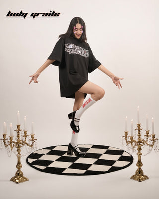 Girl Standing on Checkmate Black & White Tufted Rug