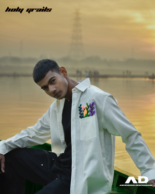 Guy in Streetwear Style 'Rangoli' White Oversized Linen Full Sleeve Shirt - Side Sitting in a Boat