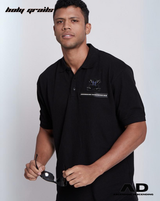 Guy in Streetwear Style 'The Polo' Black Oversized 280GSM Terry Knit Matty Cotton T-Shirt  - Front CloseUp Holding Shades