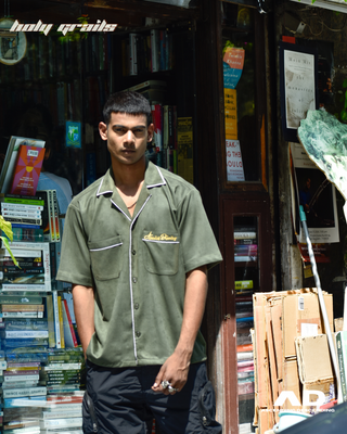 Guy in Streetwear Style 'Vintage Suede Seaweed Green' Oversized Vegan Suede Shirt - Front One Hand In Pocket