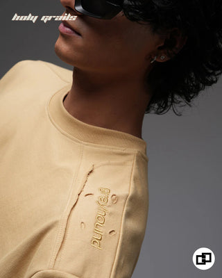 Guy in Streetwear Style 'Not So Basic' Beige 240 GSM 100% Cotton Embroidered Oversize T-Shirt HG x Grey Hound - Shoulder Close Up