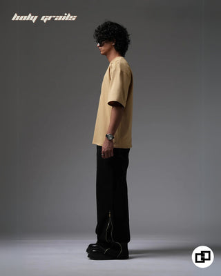 Guy in Streetwear Style 'Not So Basic' Beige 240 GSM 100% Cotton Embroidered Oversize T-Shirt HG x Grey Hound - Side 1 Full