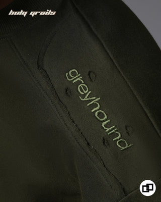 Guy in Streetwear Style 'Not So Basic' Military Green 240 GSM 100% Cotton Embroidered Oversize T-Shirt HG x Grey Hound - Shoulder Patch Close Up