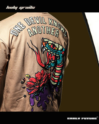 Guy in Streetwear Style 'One Devil Knows Another' Vintage Clay Beige 240 GSM 100% Terry Cotton Puff Print Oversize Graphic T-Shirt HG x Early Future - Back