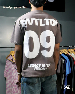 Guy in street style 'I Am Goated' Brown 260 GSM cotton oversize printed Tee HG x Pvt Ltd - Back