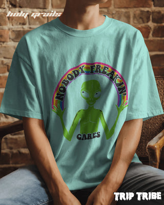 Men in Street Style '👽 Nobody Freakin’ Cares' Mint Green 240 GSM 100% Cotton Oversize Tee HG x Trip Tribe - Front Close