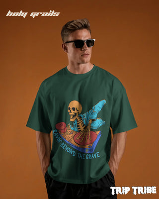 Men in Street Style 'Ravin’ Beyond the Grave Skeleton DJ' Bottle Green 240 GSM 100% Cotton Oversize Tee HG x Trip Tribe - Front