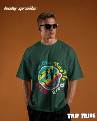 Men in Street Style 'Stay Humble Hustle Hard' Bottle Green 240 GSM 100% Cotton Oversize Tee HG x Trip Tribe - Front