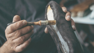 Man making a pair with hands - How Homegrown Indian Sneaker Brands Are Stepping Onto the Global Stage - Featured Image