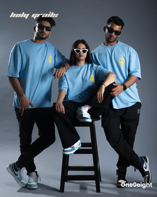 2 Guy standing and 1 girl sitting in between wearing Street Style 'Shantamurti Shiva' Blue 240 GSM 100% Cotton Screen & Puff Printed Oversize Tee HG x One0eight - Front