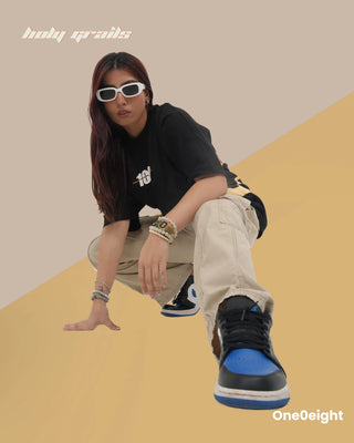 Girl Sitting in Street Style 'Hanuman Force of Faith' Black 240 GSM 100% Cotton Screen & Puff Printed Oversize Tee - Front