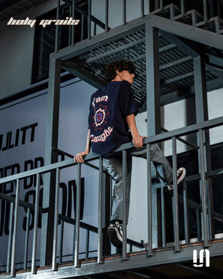 Guy Sitting in Street Style 'Webbed Up' Navy Blue 240 GSM French Terry Lycra Graphic Printed Oversize Fit Tee HG x Sullitt - Back Full