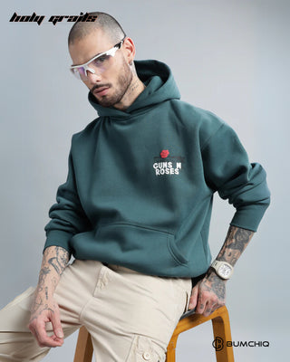 Guy Sitting on Chair in Streetwear 'Guns & Roses' Dark Teal 350-370 GSM 100% Cotton Puff Print Oversize Hoodie HG x Bumchiq - Front