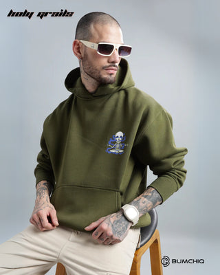 Guy Sitting on a Chair in Streetwear 'Dope' Olive Green 350-370 GSM 100% Cotton Oversize Puff Print Hoodie HG x Bumchiq - Front