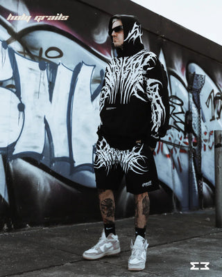 Guy Standing in Streetwear Style 'Goth' Black & White 380 GSM 100% Cotton Graphic Oversize Hoodie HG x Jammer - Side Full