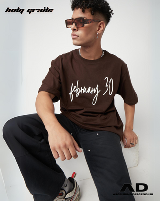 Guy in Streetwear Style 'February 30' Brown Oversized 250 GSM French Terry Knit Cotton T-Shirt - Front Sitting