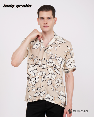 Guy in Streetwear Style 'Stone Floral Tea' Cream Poplin Shirt - Front Holding Collar