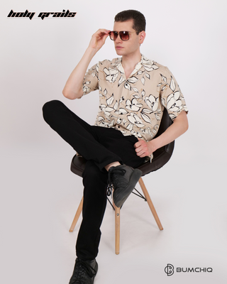 Guy in Streetwear Style 'Stone Floral Tea' Cream Poplin Shirt - Front Sitting on Chair