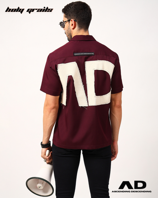 Guy in Streetwear Style 'The Editable' Wine 250 GSM Cotton Shirt - Back Holding Micro Phone
