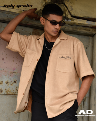 Guy in Streetwear Style 'Vintage Suede Mustard' Beige Oversized Vegan Suede Shirt - Front Paired with black t-shirt, pants & Shades