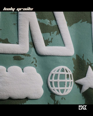 Guy in Street Style 'Coastline Art' Green Oversize 260 GSM Cotton Printed Tee HG x Pvt Ltd - Front Puff Print Close Up 1
