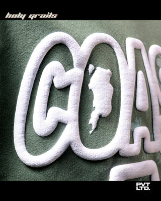 Guy in Street Style 'Coastline Art' Green Oversize 260 GSM Cotton Printed Tee HG x Pvt Ltd - Front Puff Print Close Up 2