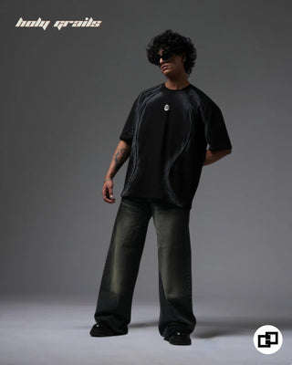 Guy in Street Style 'Divine Violence' Black Spray Painted 240 GSM 100% Cotton Oversize Tee - Front Full Side 1
