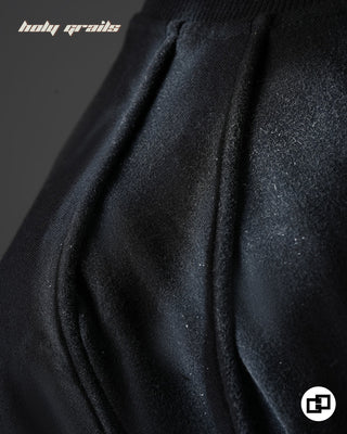 Guy in Street Style 'Divine Violence' Black Spray Painted 240 GSM 100% Cotton Oversize Tee - Shoulder Close Up
