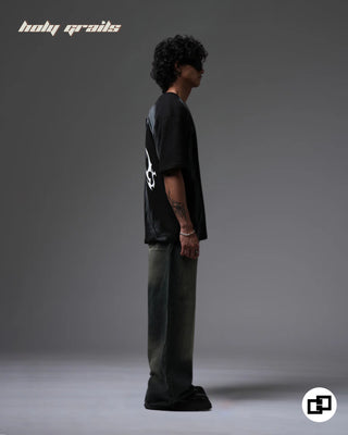 Guy in Street Style 'Divine Violence' Black Spray Painted 240 GSM 100% Cotton Oversize Tee - Side Full