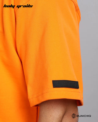 Guy in Street Style 'God's Got This' Orange 240 GSM 100% Terry Cotton Screen Printed Oversize Graphic Tee HG x Bumchiq - Sleeve Close Up