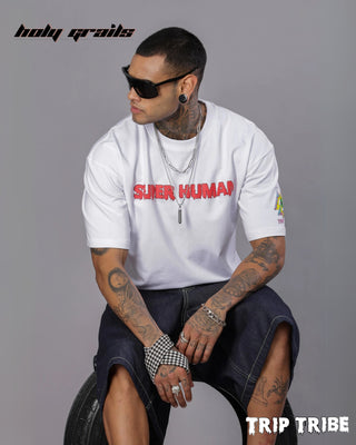 Guy in Street Style 'Molly' White 240 GSM 100% Cotton Oversize Graphic T-Shirt HG x Trip Tribe - Front Sitting on Tire