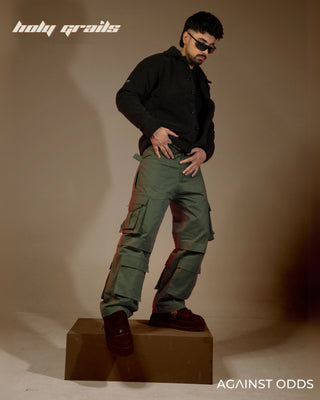 Guy in Streetwear Style 'Dk Green' 320 GSM 100% Cotton Baggy Cargo Pant HG x Against Odds - Front Side 1 Full