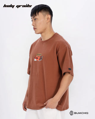Guy in Streetwear Style 'FCK World' Brown 240 GSM 100% Terry Cotton Oversize Graphic T-Shirt HG x Bumchiq - Side 1