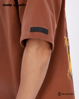 Guy in Streetwear Style 'FCK World' Brown 240 GSM 100% Terry Cotton Oversize Graphic T-Shirt HG x Bumchiq - Sleeve Close Up