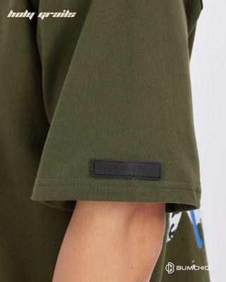 Guy in Streetwear Style 'No One' Green 240 GSM 100% Terry Cotton Oversize Graphic T-Shirt HG x Bumchiq - Sleeve Close Up