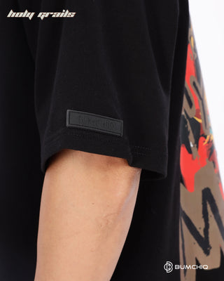 Guy in Streetwear Style 'Own Muse' Black 240 GSM 100% Terry Cotton Oversize Graphic T-Shirt HG x Bumchiq - Sleeve Close Up