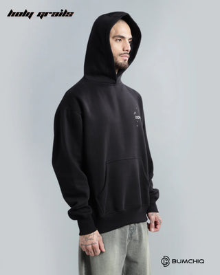 Guy Standing in Streetwear 'Coldplay' Black 350-370 GSM 100% Cotton Printed Oversize Hoodie HG x Bumchiq - Front with Hood On