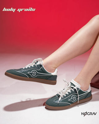 Women wearing Homegrown 'Dirty Martini' Deep Green Premium PU Upper, Cushioned Footbed, Eva Midsole & Rubber Outsole Lightweight Sneaker HG x NoGrav - Sides in Feet