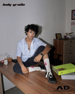 Men sitting on a desk in an office setting with books wearing a Street Style 'Switch' Blue & White Stripes Cotton Convertible Shirt HG x AD - Front