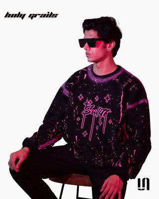 Men Sitting on Chair in 'Chaos Paint' Black 400 GSM Suede Fabric Printed Oversize Swearshirt HG x Sullitt - Front