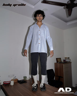 Men wearing a Street Style 'Switch' Blue & White Stripes Cotton Convertible Shirt and dark pants standing in a room on a desk with ceiling fan - Front