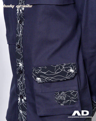 Black full sleeve shirt with white floral patterns on a plain background
