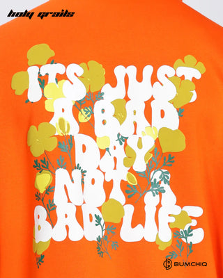 Men in Streetwear Style 'Day Life' Orange 350-370 GSM Puff Printed Oversize Graphic Hoodie HG x Bumchiq - Back Close Up