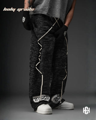 Men in 'Manushya Karam' Black Unisex 320 GSM 100% Cotton Fleece Digital Printed Baggy Pants HG x Charactr - Front Side 1