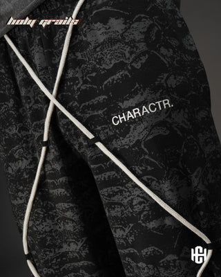Men in 'Manushya Karam' Black Unisex 320 GSM 100% Cotton Fleece Digital Printed Baggy Pants HG x Charactr - Front Side 2 Close Up