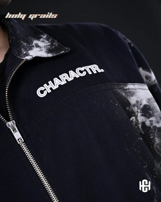 Men in 'The Cosmic' Midnight Black Cotton Twill Oversize Zipper Jacket HG x Charactr - Front Branding Print Close Up