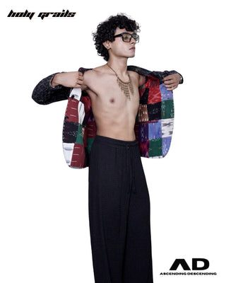 Man with a Street Style 'Eat the Rich' Multi-Color Reversible Blazer HG x Ascending Descending - Colorful Patchwork Blazer Jacket Over His Shoulders - Front Side