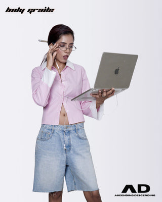 Women holding a laptop and pen, wearing a Street Style 'Blush Boss Crop' Pink & White Stripes Full Sleeve Cotton Shirt and denim shorts - Front