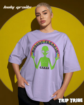 Women in Street Style '👽 Nobody Freakin’ Cares' Lavender 240 GSM 100% Cotton Oversize Tee HG x Trip Tribe - Front